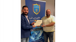 The businessman Mr Ahmad Abdel Karim receives the certificate of participation and appreci...